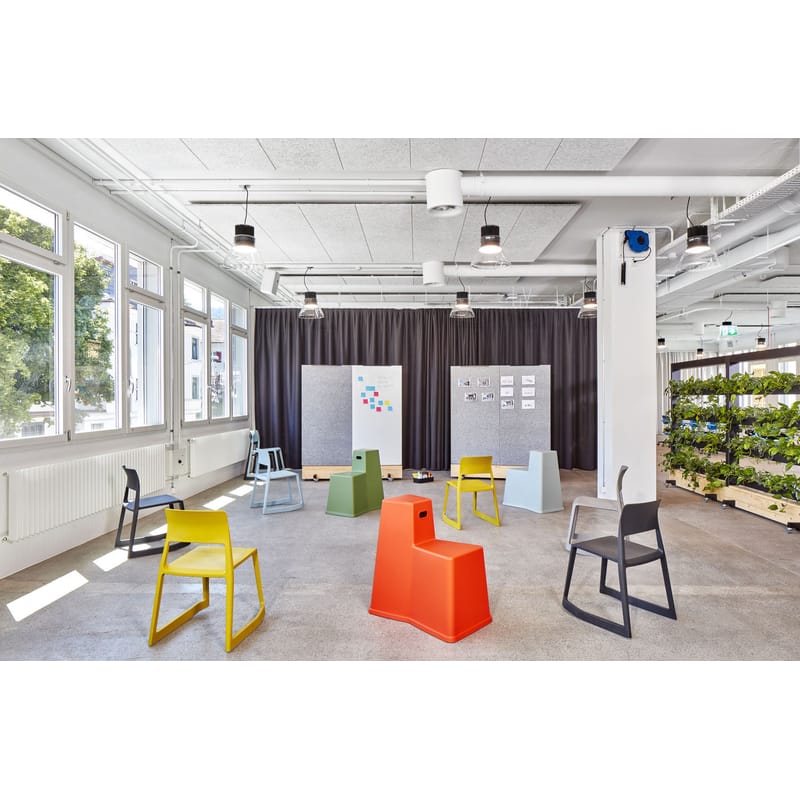 Inclined plastic store chair