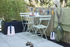 Tavolo pieghevole Bistro - / 77 x 57 cm - 4 persone / Foro per ombrellone di Fermob